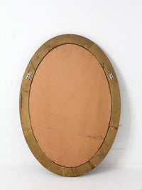 mid-century oval gilt wall mirror