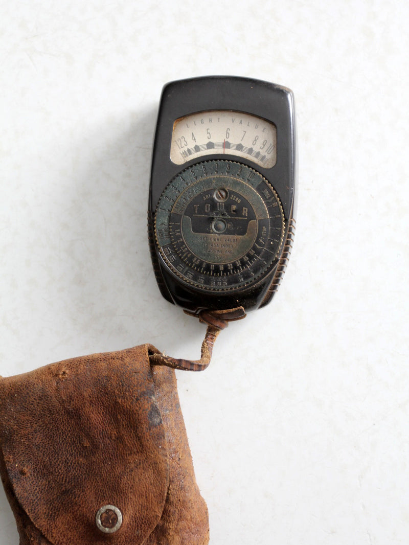 vintage Tower brand gauge with leather pouch