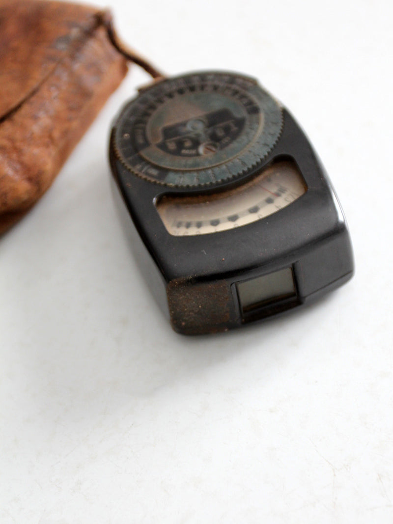 vintage Tower brand gauge with leather pouch
