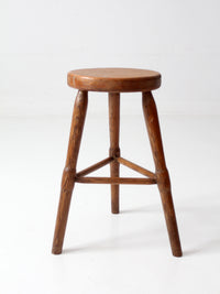 antique primitive three-legged wooden stool