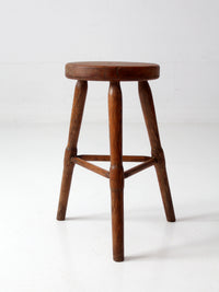 antique primitive three-legged wooden stool