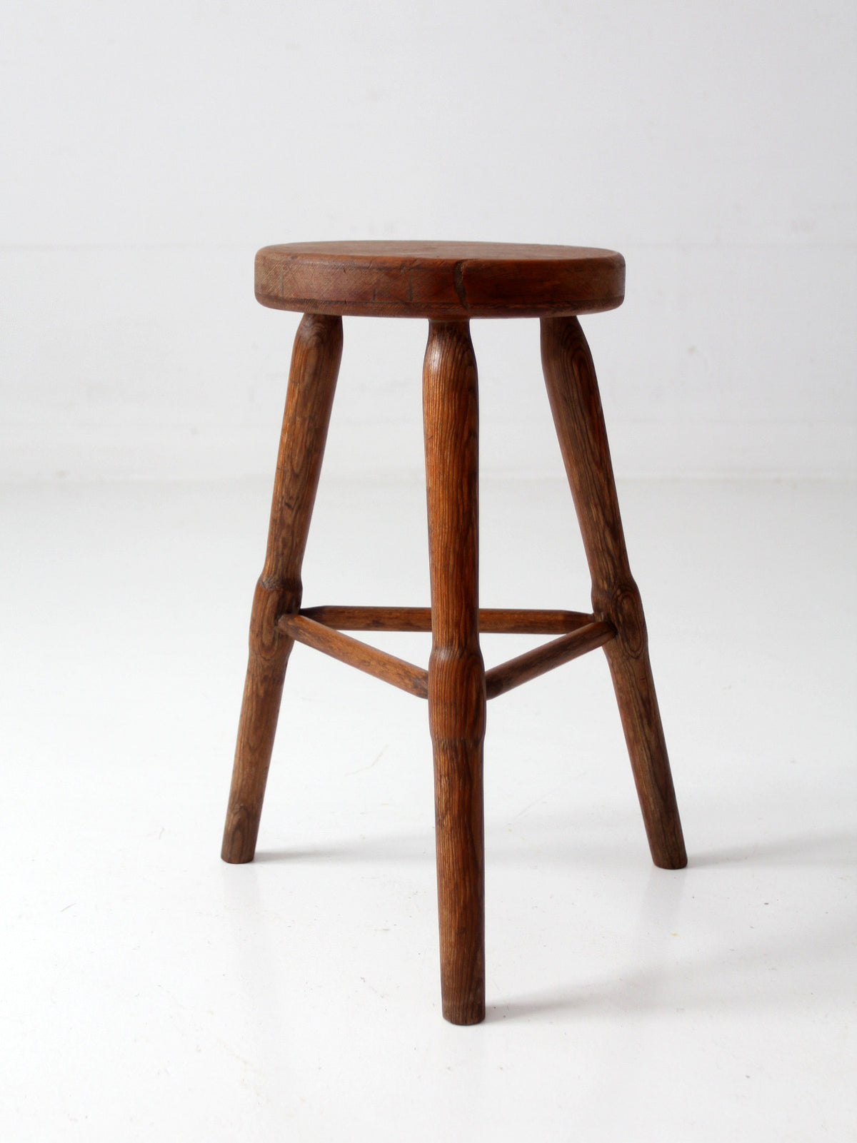 antique primitive three-legged wooden stool