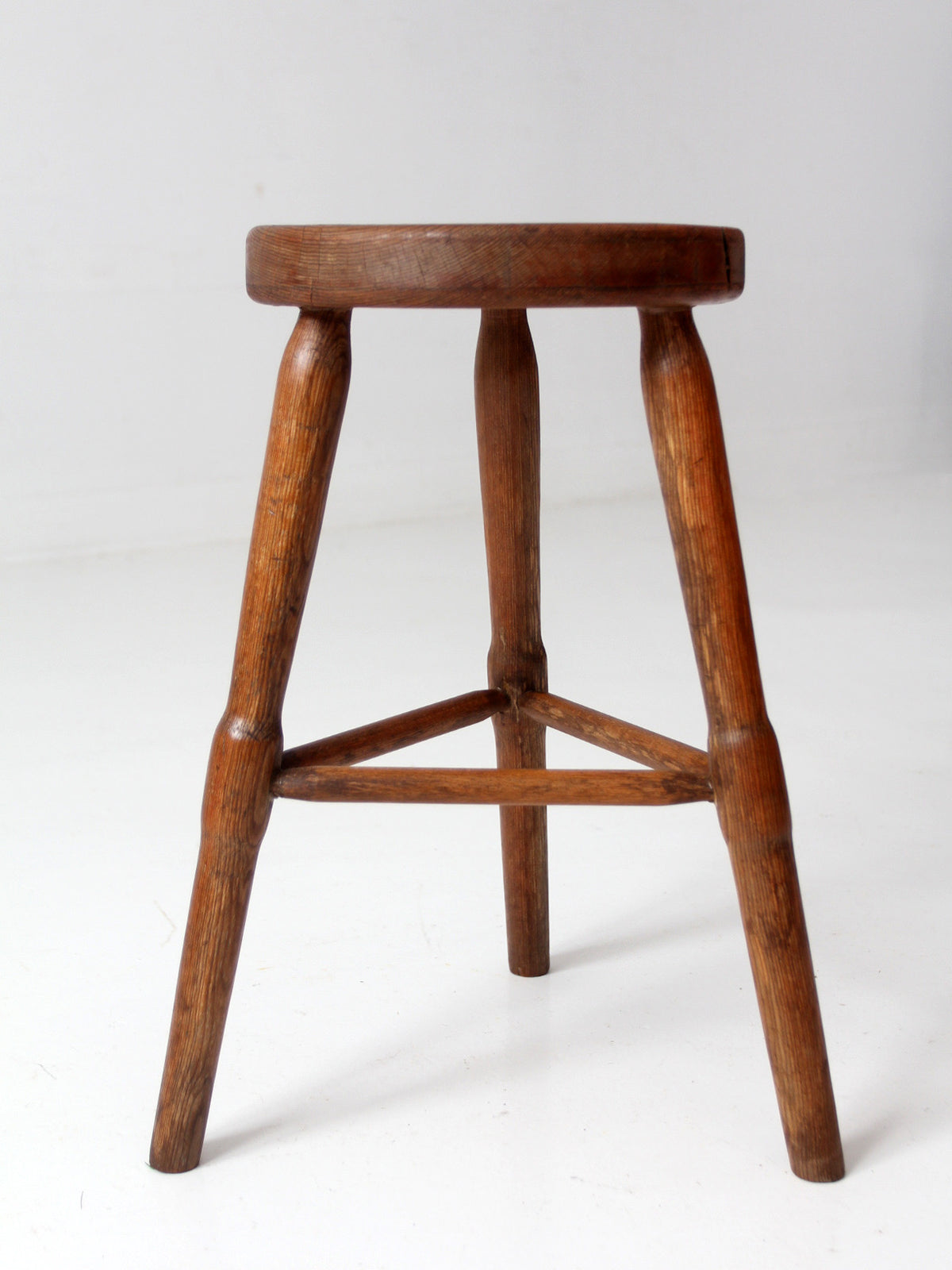 antique primitive three-legged wooden stool