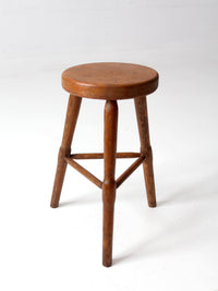 antique primitive three-legged wooden stool