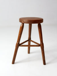 antique primitive three-legged wooden stool