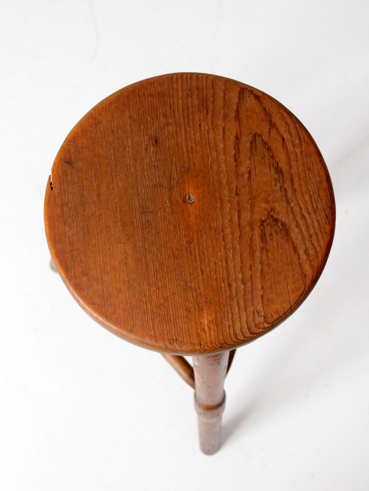 antique primitive three-legged wooden stool