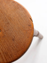 antique primitive three-legged wooden stool