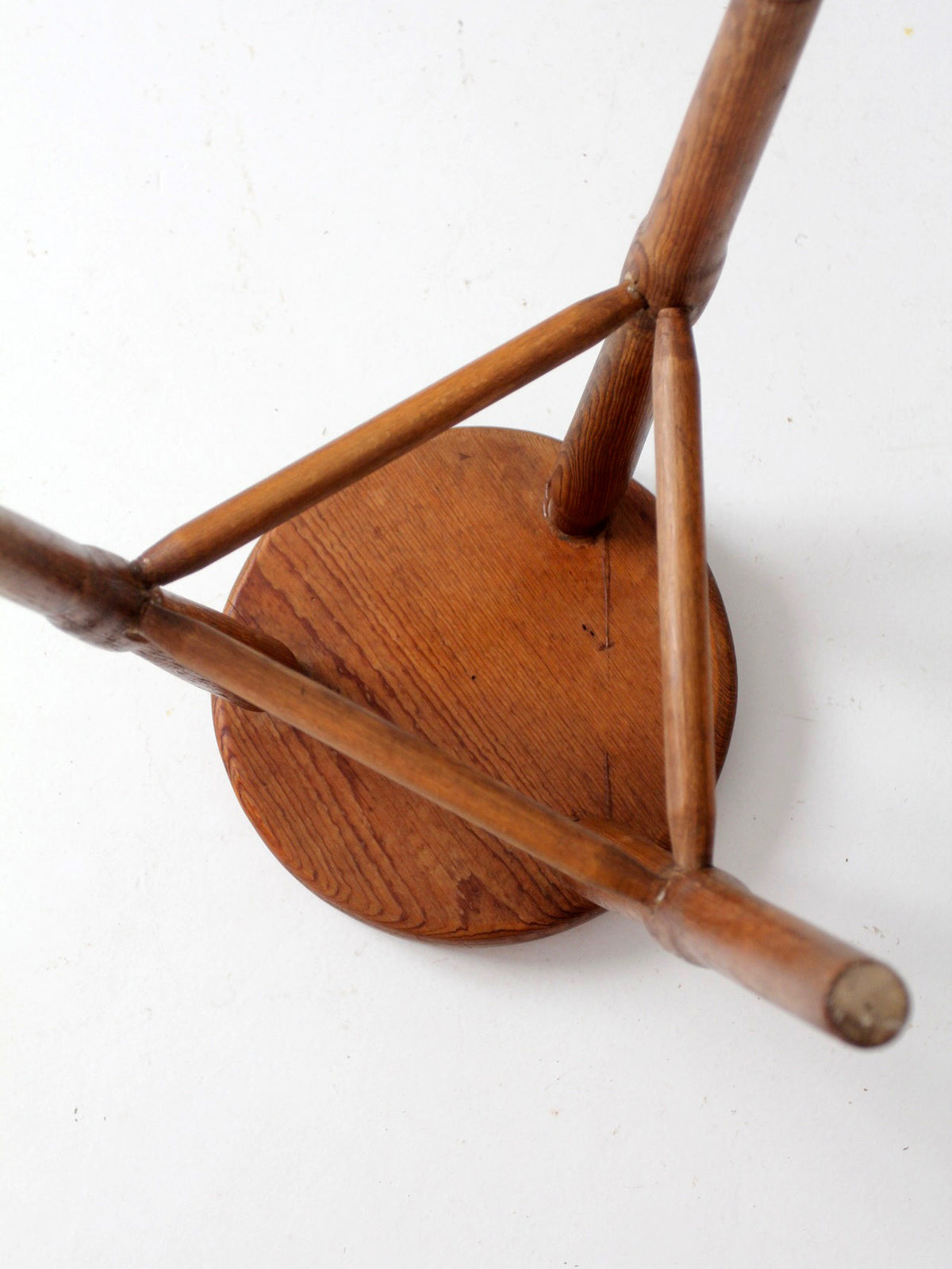 antique primitive three-legged wooden stool