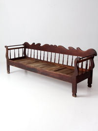antique 19th century wooden spindle back bench with scalloped crest rail