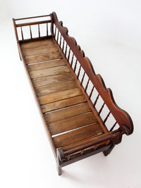 antique 19th century wooden spindle back bench with scalloped crest rail