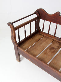 antique 19th century wooden spindle back bench with scalloped crest rail