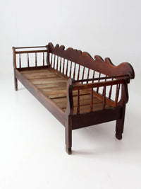 antique 19th century wooden spindle back bench with scalloped crest rail