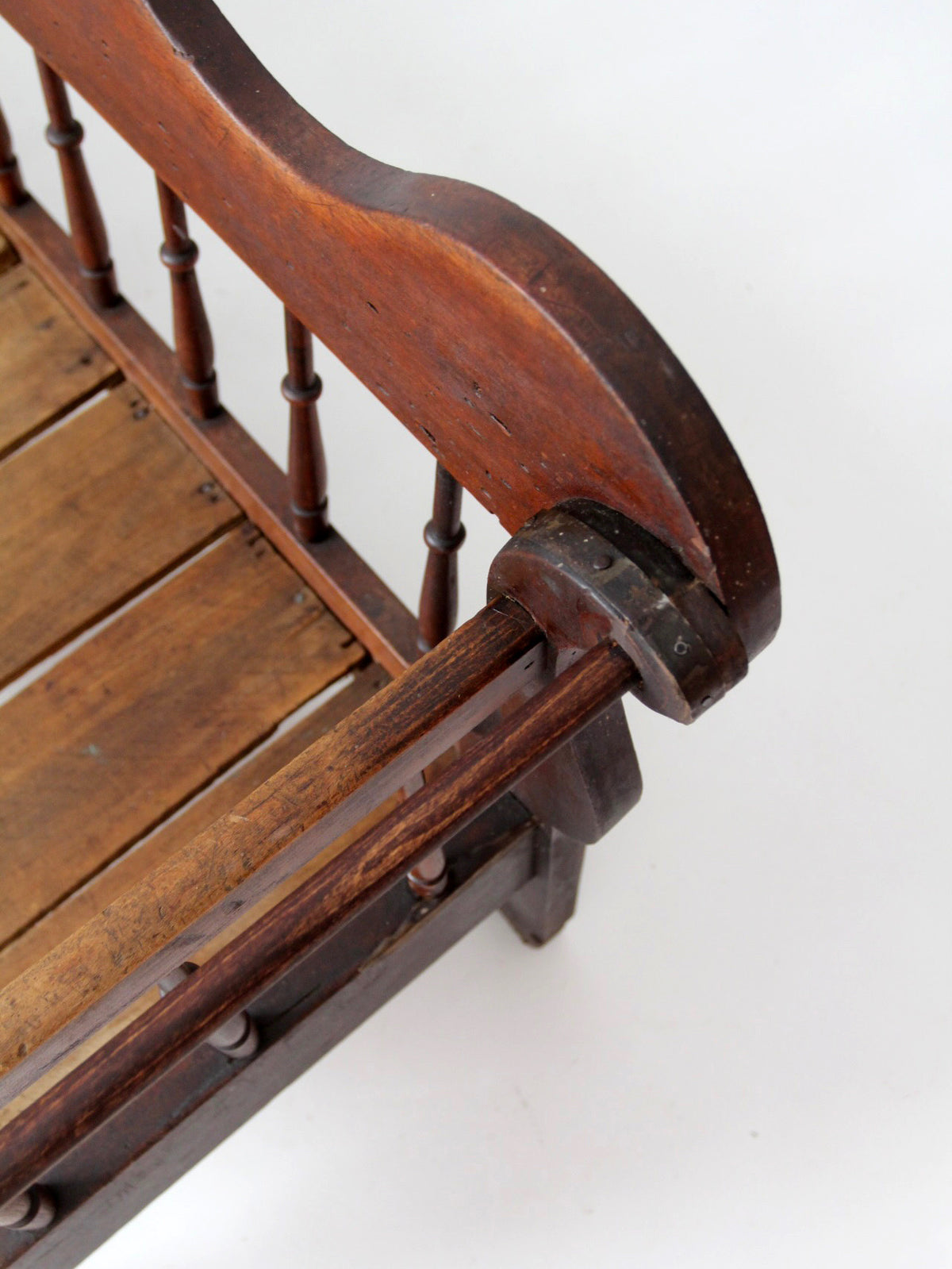 antique 19th century wooden spindle back bench with scalloped crest rail