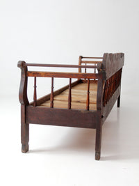 antique 19th century wooden spindle back bench with scalloped crest rail