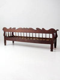 antique 19th century wooden spindle back bench with scalloped crest rail