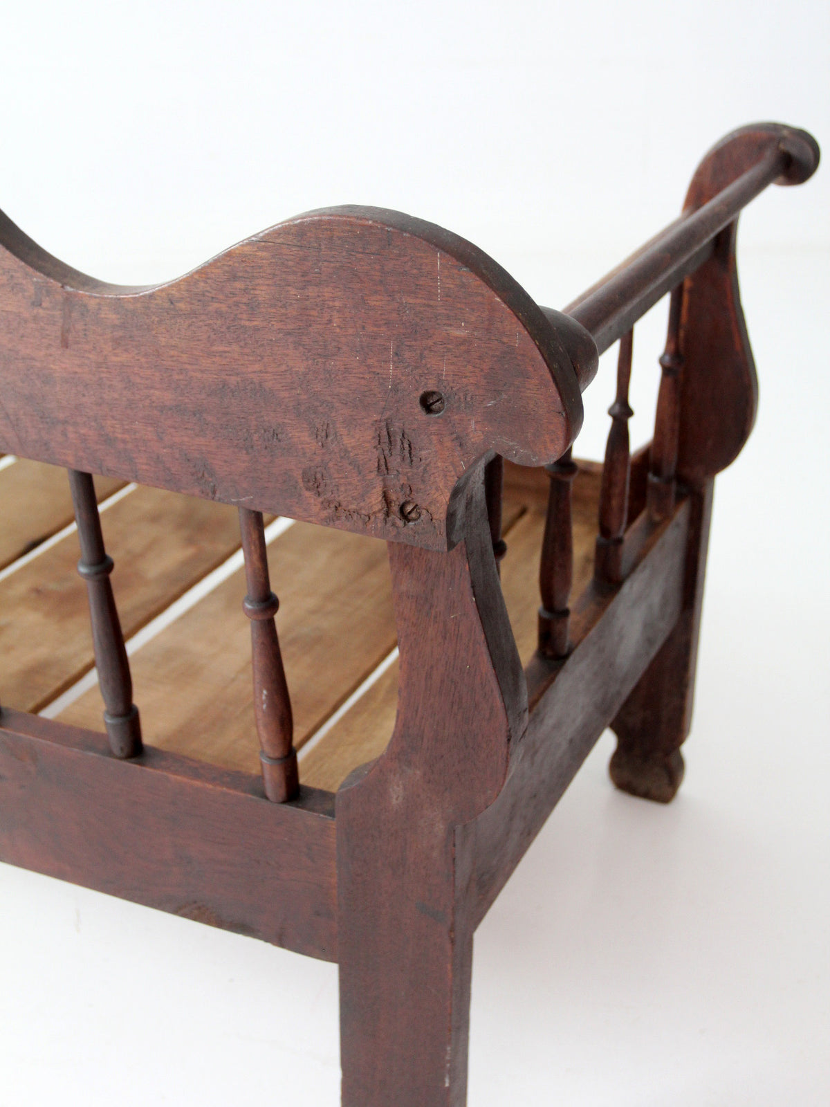 antique 19th century wooden spindle back bench with scalloped crest rail