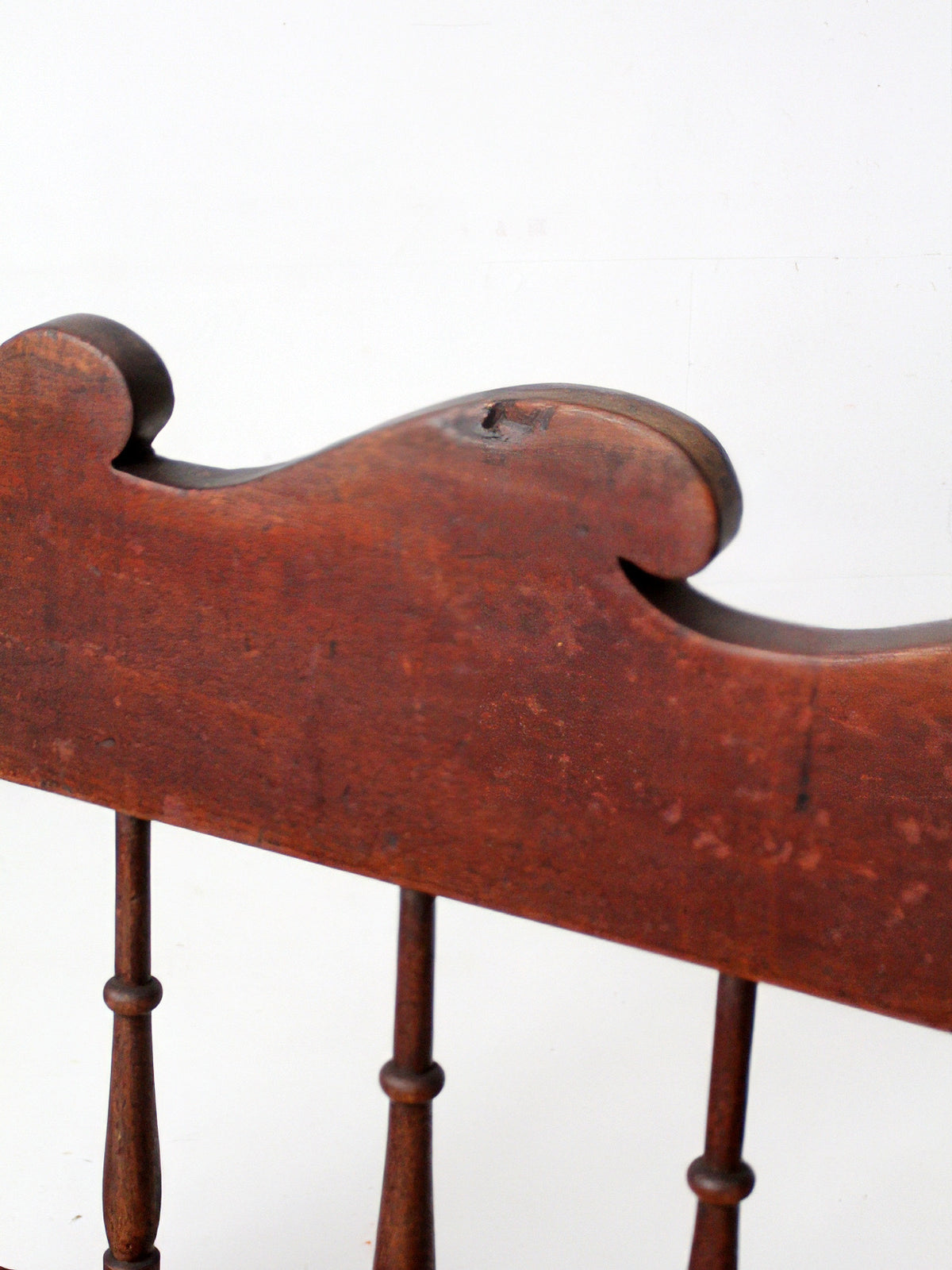 antique 19th century wooden spindle back bench with scalloped crest rail