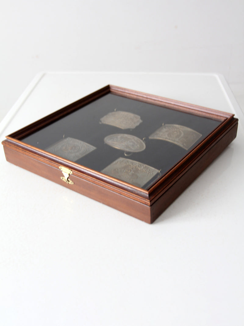 vintage 1970s belt buckles with Americana logos