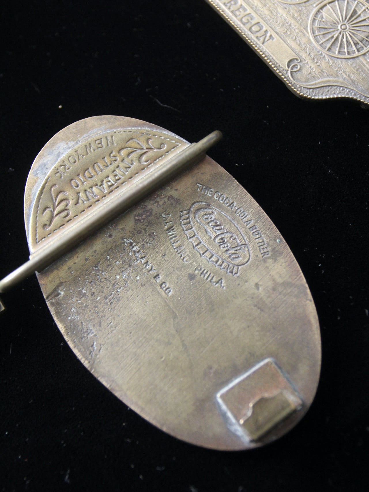 vintage 1970s belt buckles with Americana logos