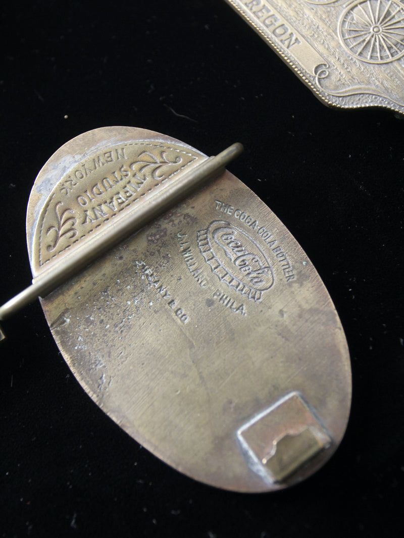 vintage 1970s belt buckles with Americana logos