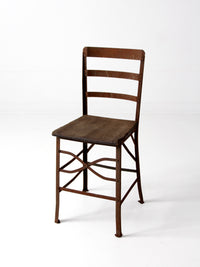 antique early 20th century riveted metal chair with wood seat