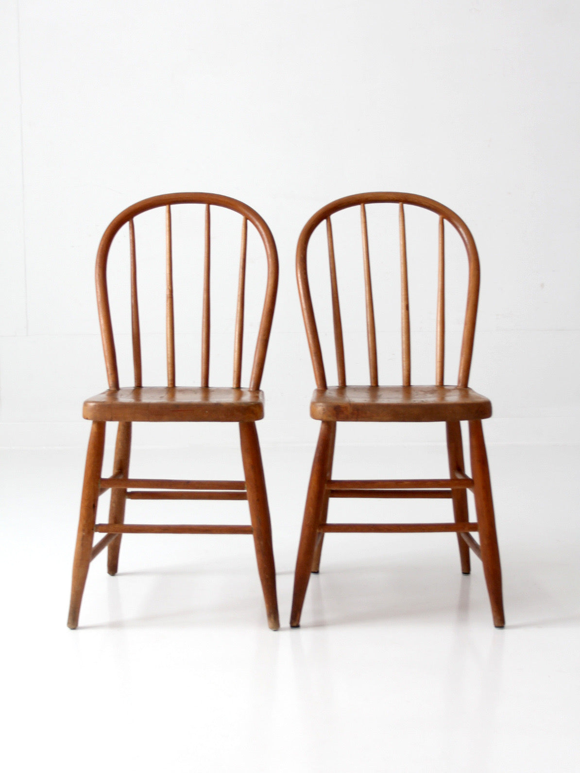 pair of vintage Windsor bow back chairs