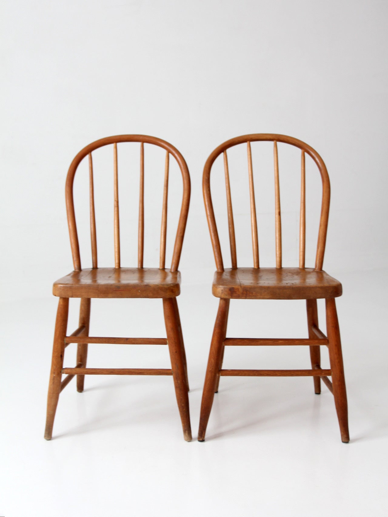 pair of vintage Windsor bow back chairs