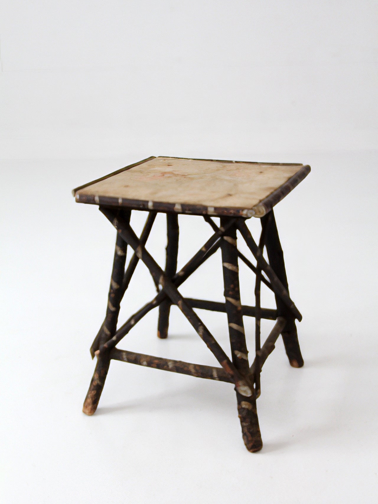 antique Adriondack twig table with floral top