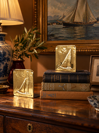 mid-century brass sailboat bookends