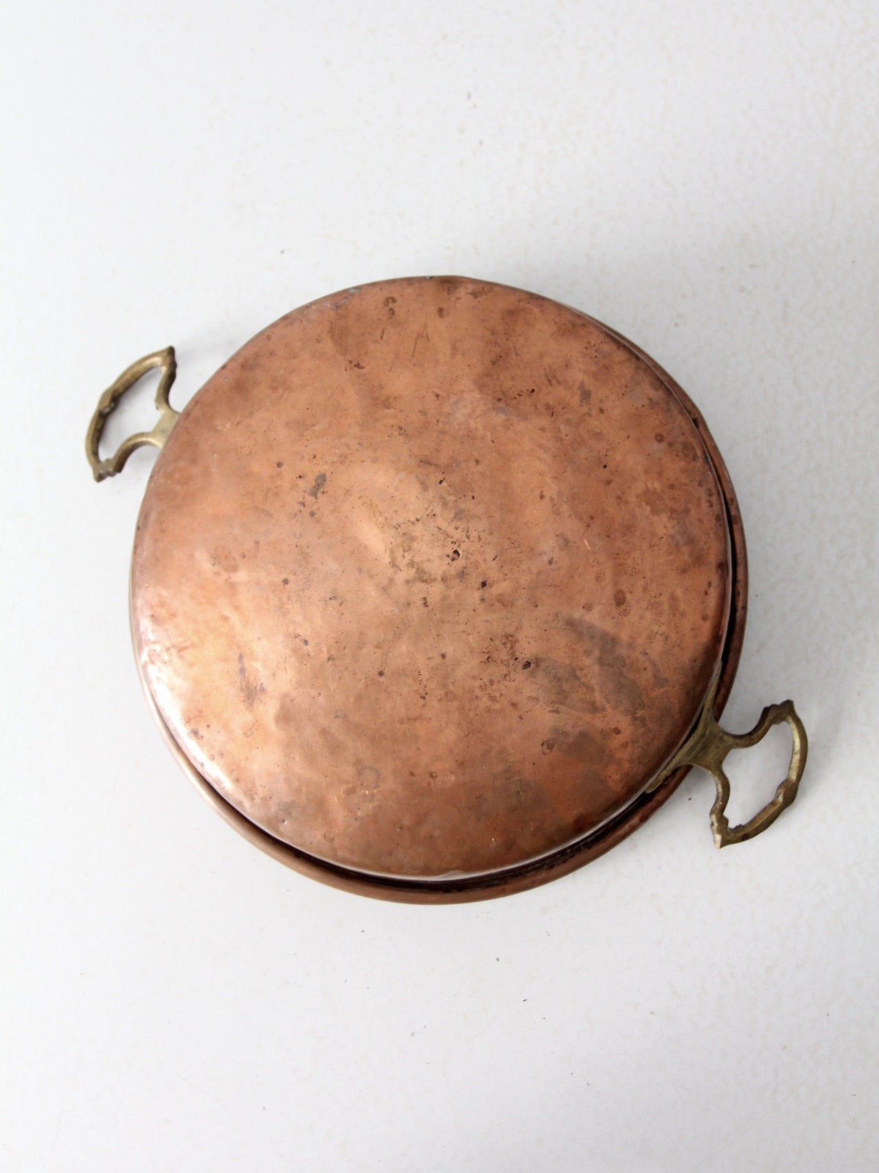 antique copper pan with brass handles