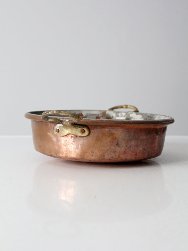 antique copper pan with brass handles