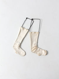 antique children's sock stretcher displays