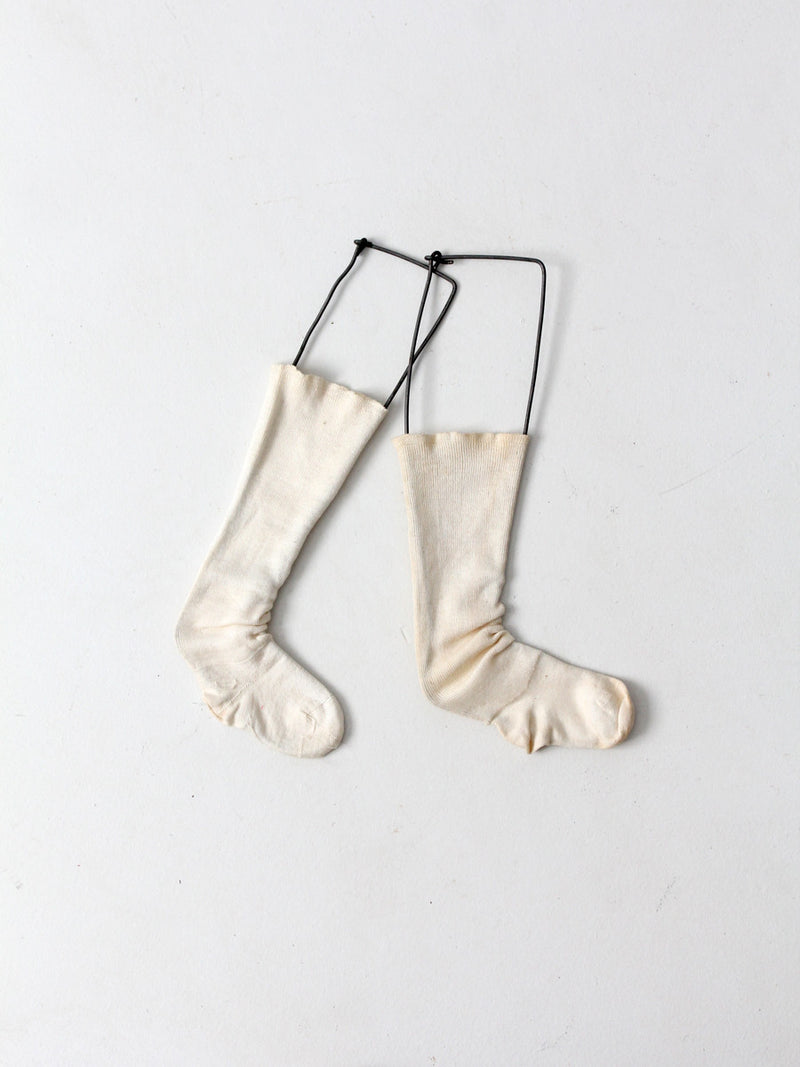 antique children's sock stretcher displays