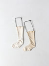 antique children's sock stretcher displays