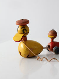 vintage early 50s Fisher Price "quacky duck and family" pull toy