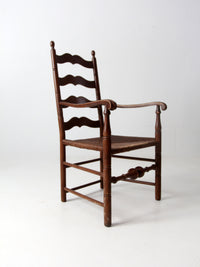 antique rush seat wooden arm chair