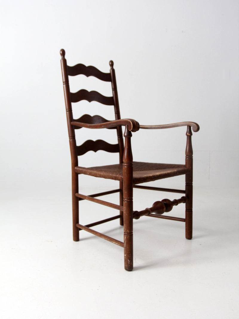 antique rush seat wooden arm chair