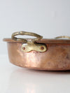 antique copper pan with brass handles