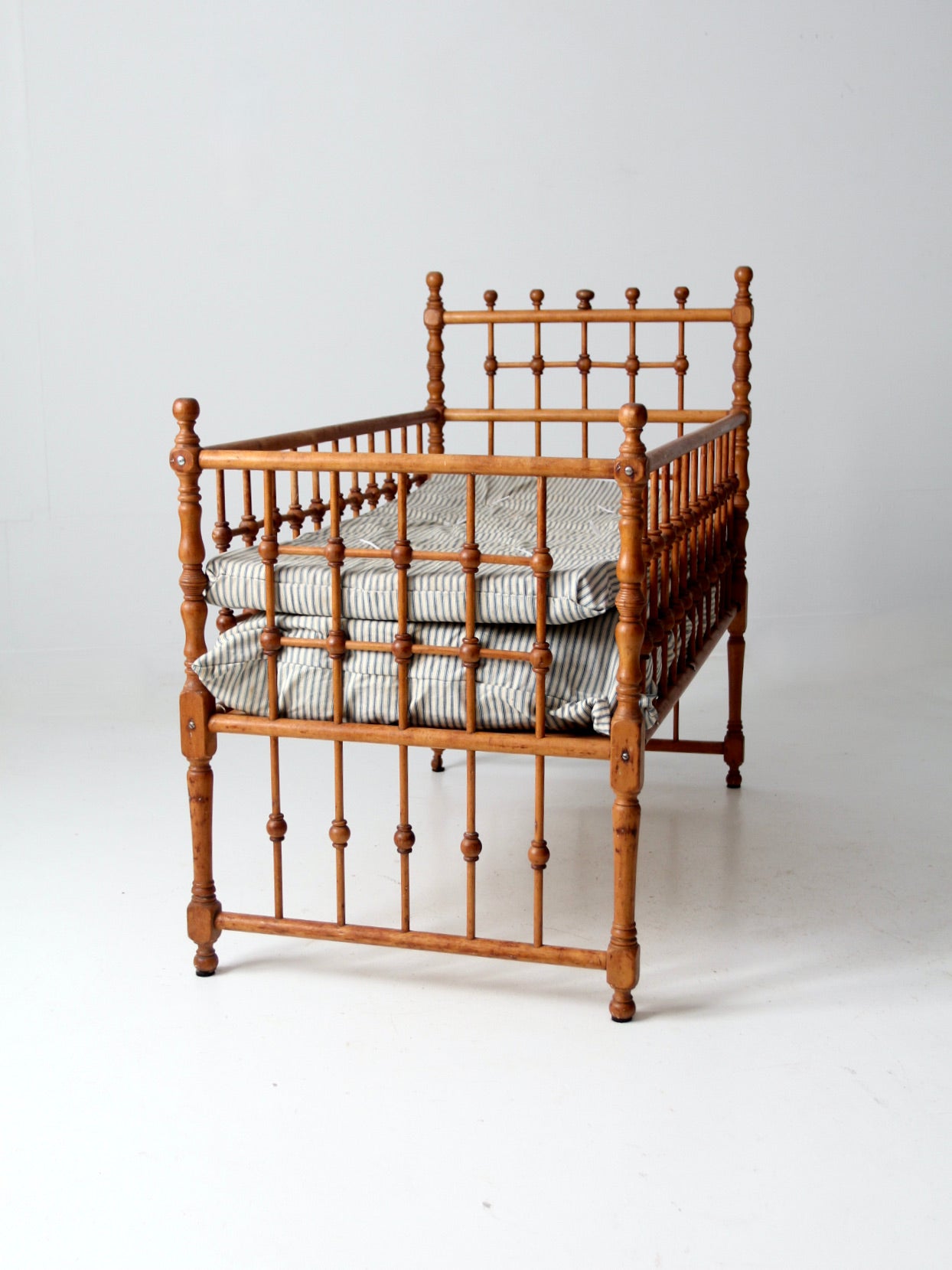 antique Victorian wooden frame bed