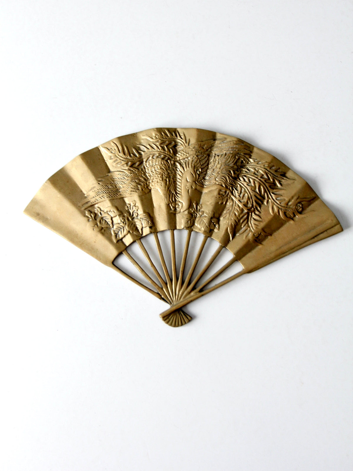 mid-century figurative brass fan wall hanging