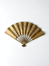 mid-century figurative brass fan wall hanging