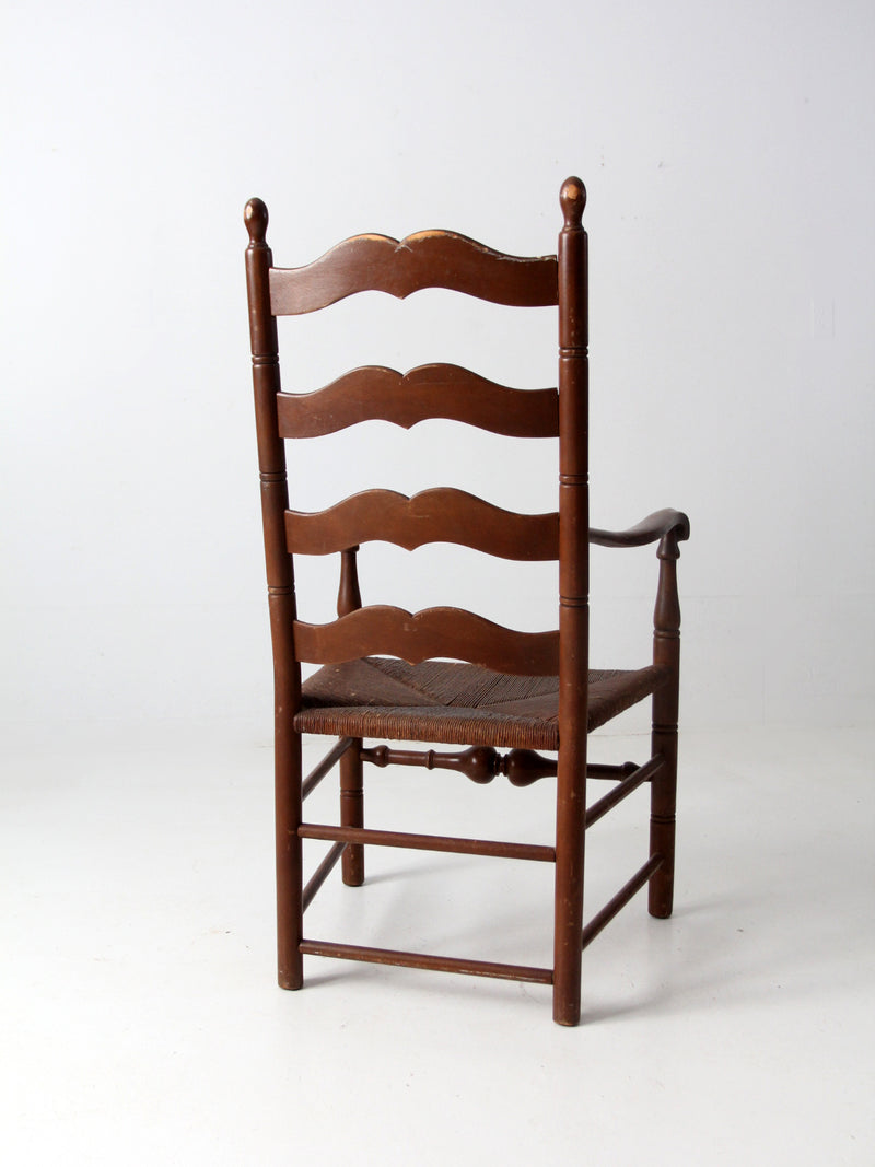 antique rush seat wooden arm chair