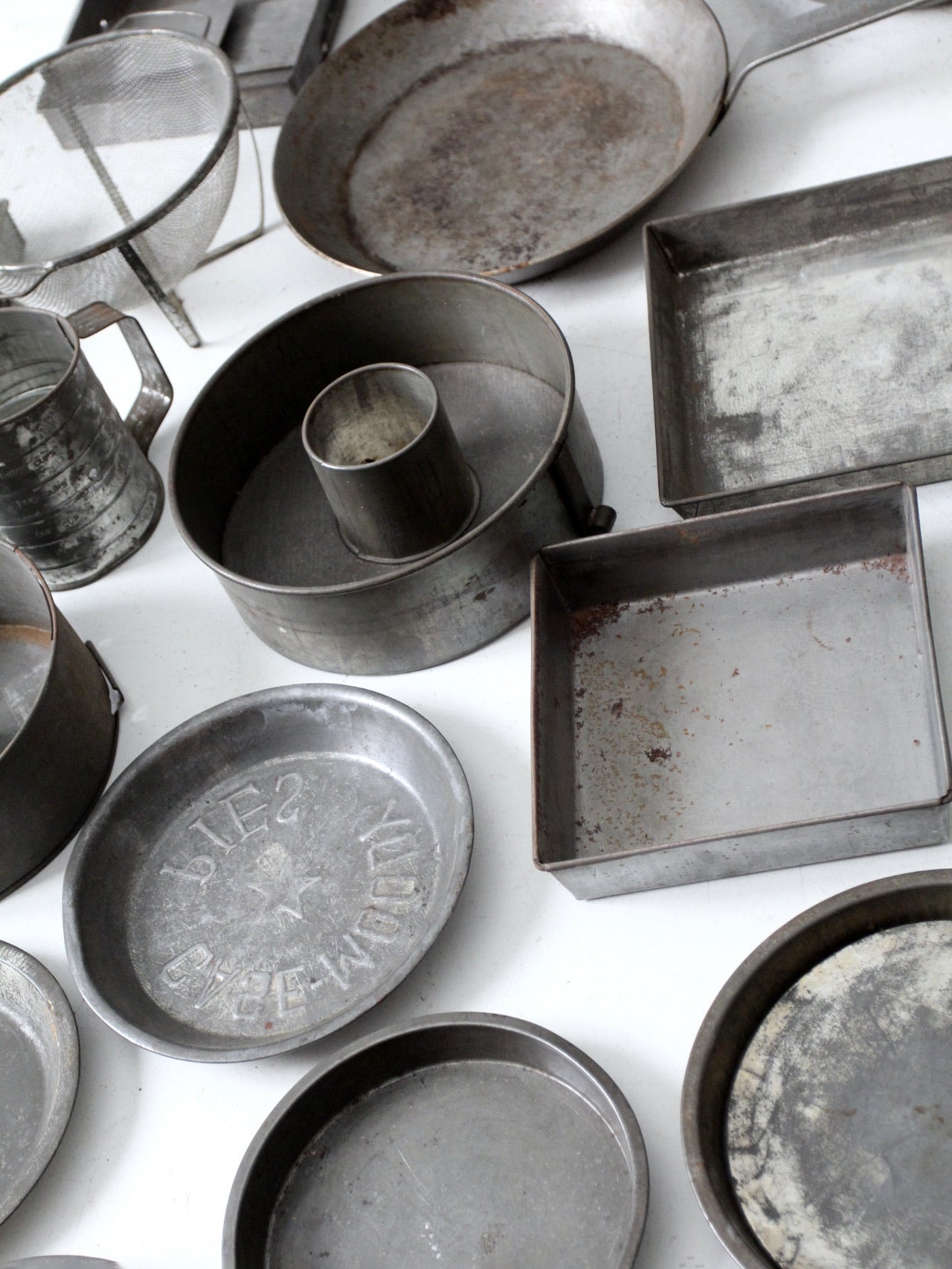 collection of vintage cake pans, pie plates & bread loaf baking