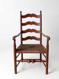 antique rush seat wooden arm chair