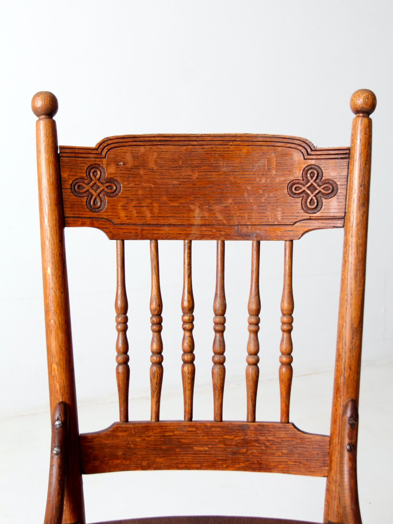 antique wooden chair with Celtic knot design