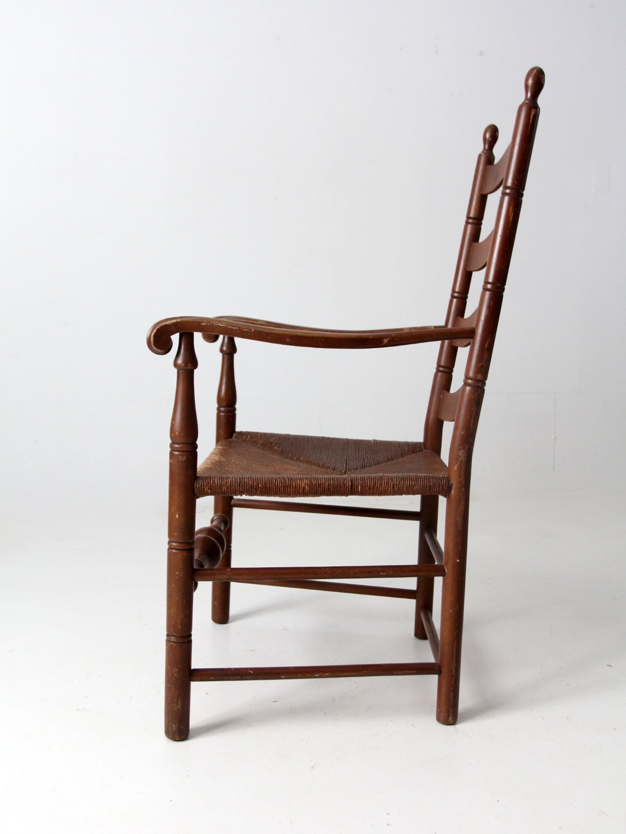 antique rush seat wooden arm chair