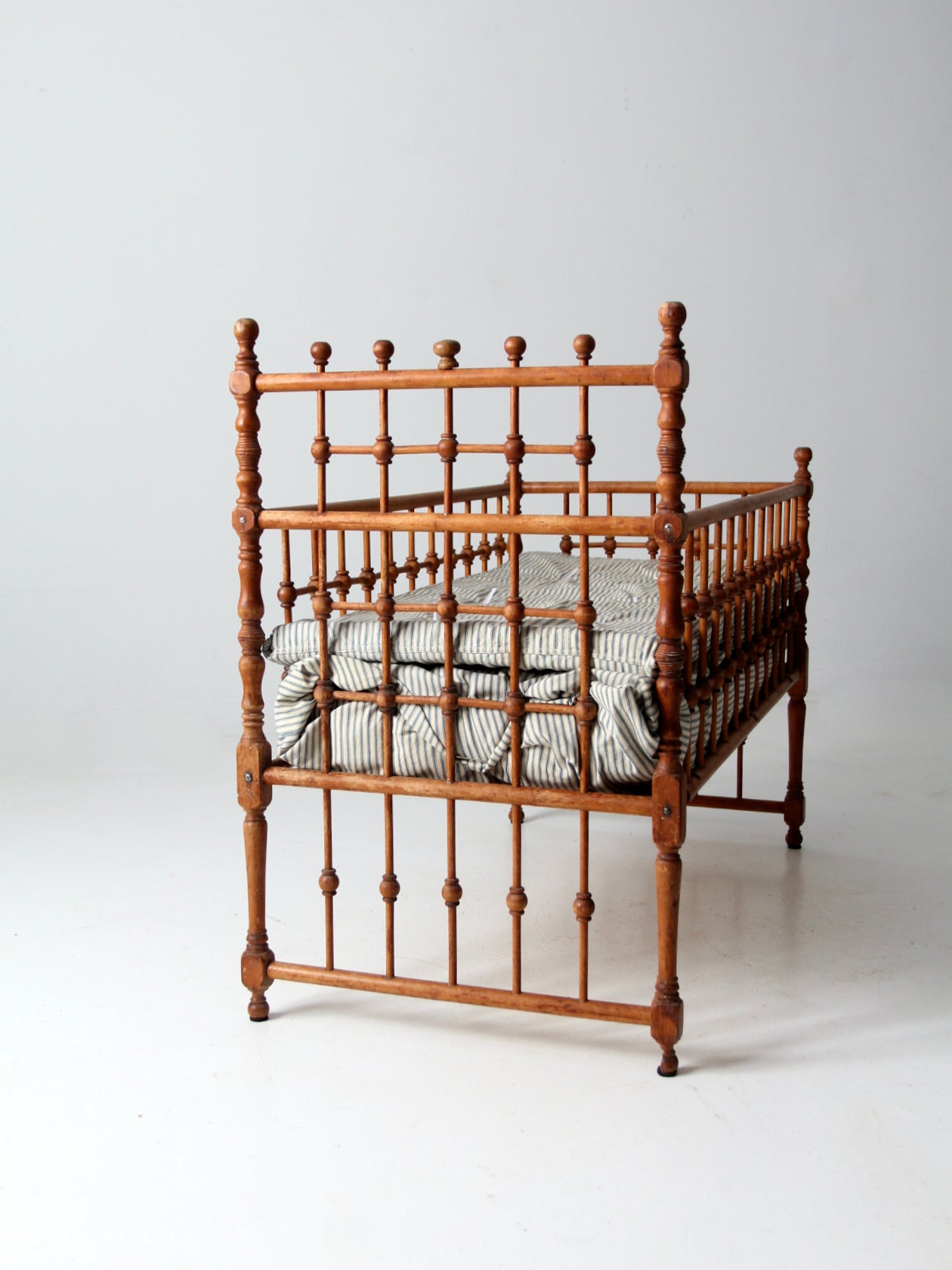 antique Victorian wooden frame bed