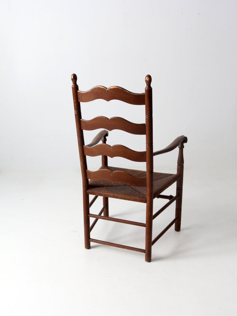 antique rush seat wooden arm chair