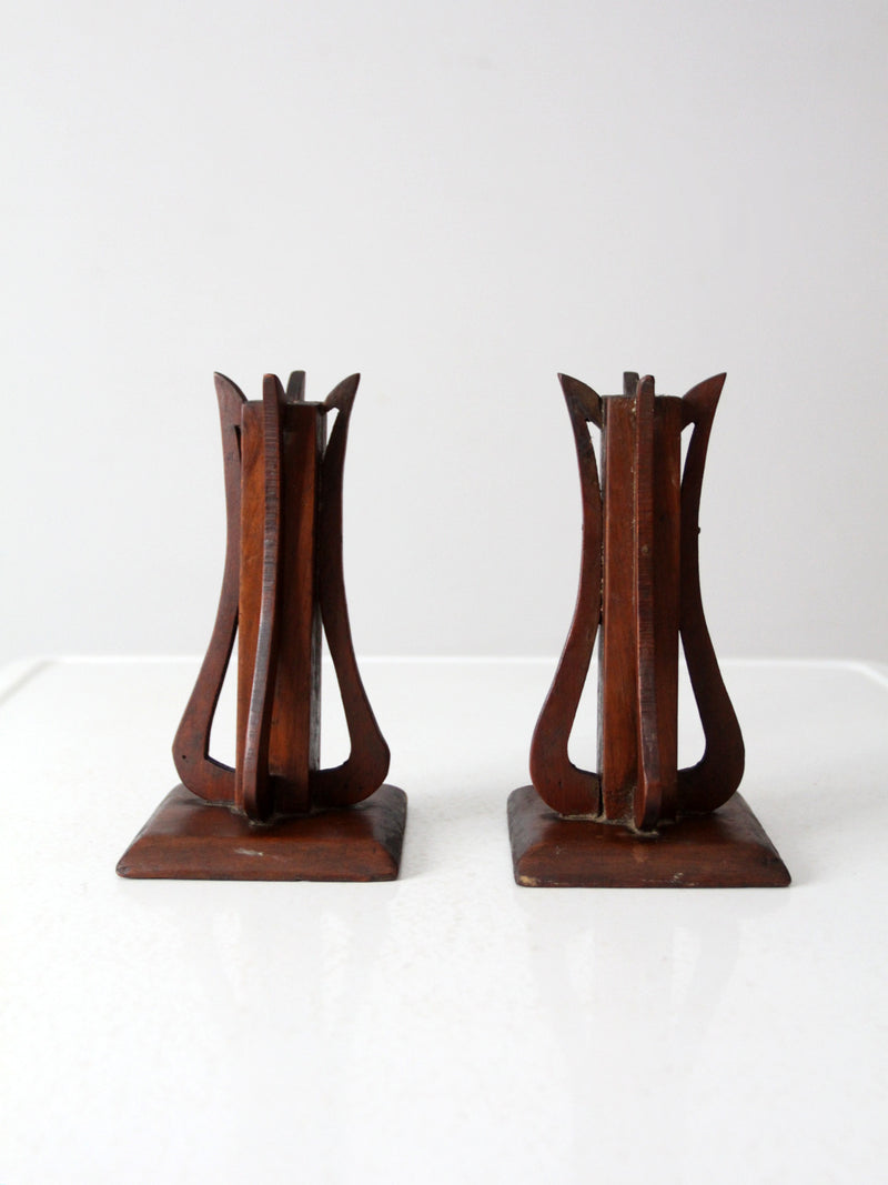 antique wooden candlestick holder pair