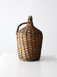 vintage demijohn with basket casing